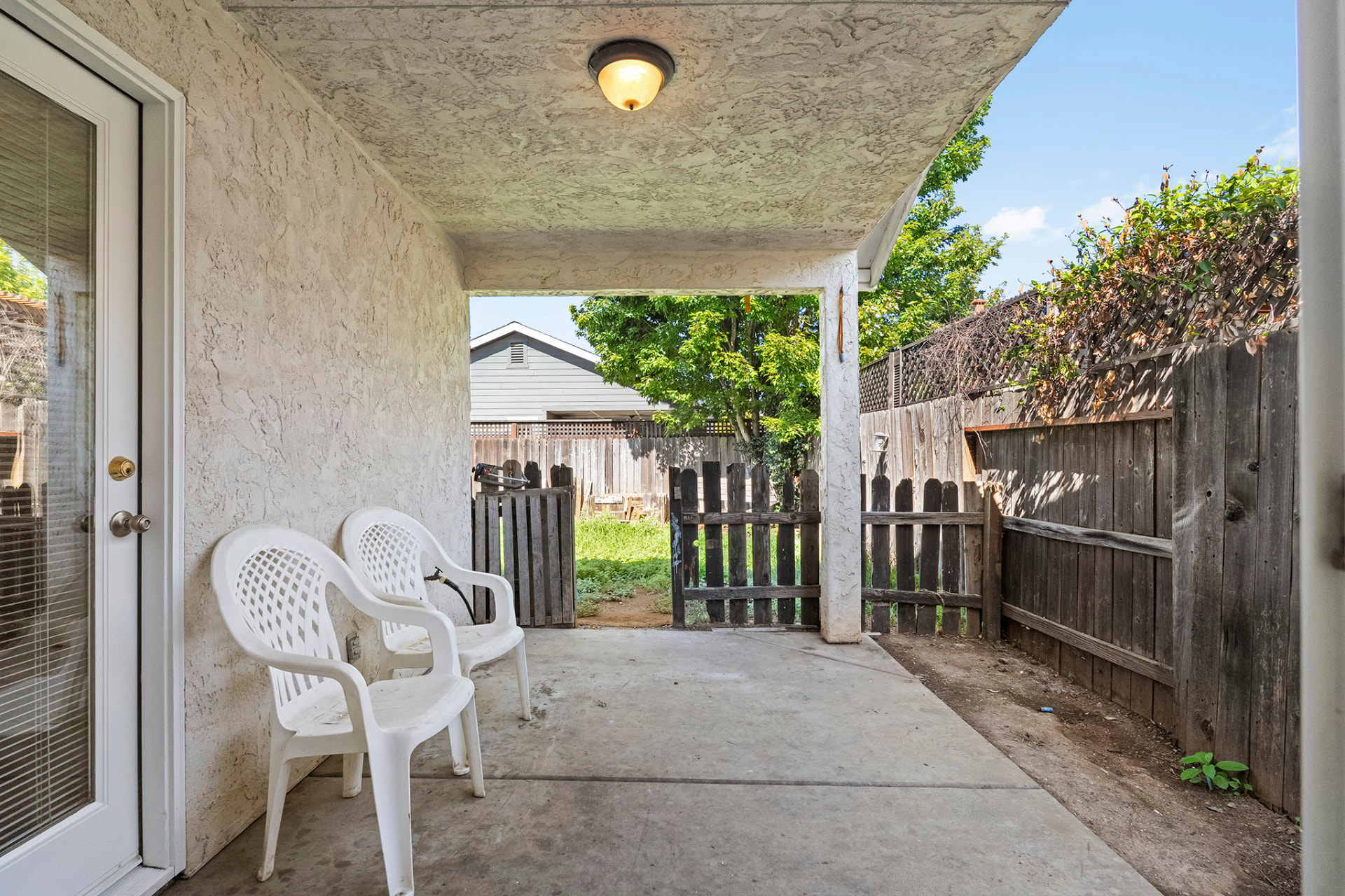 Covered concrete patio off the kitchen slider
