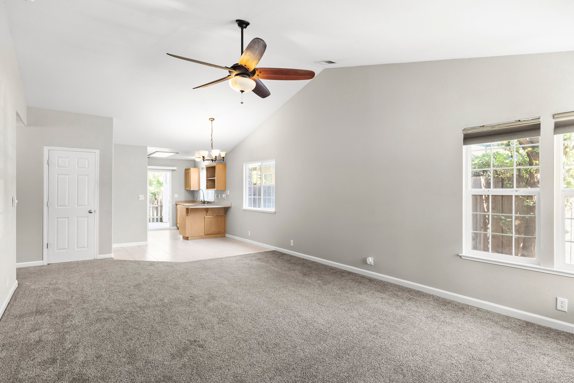 Vaulted living room open to the kitchen