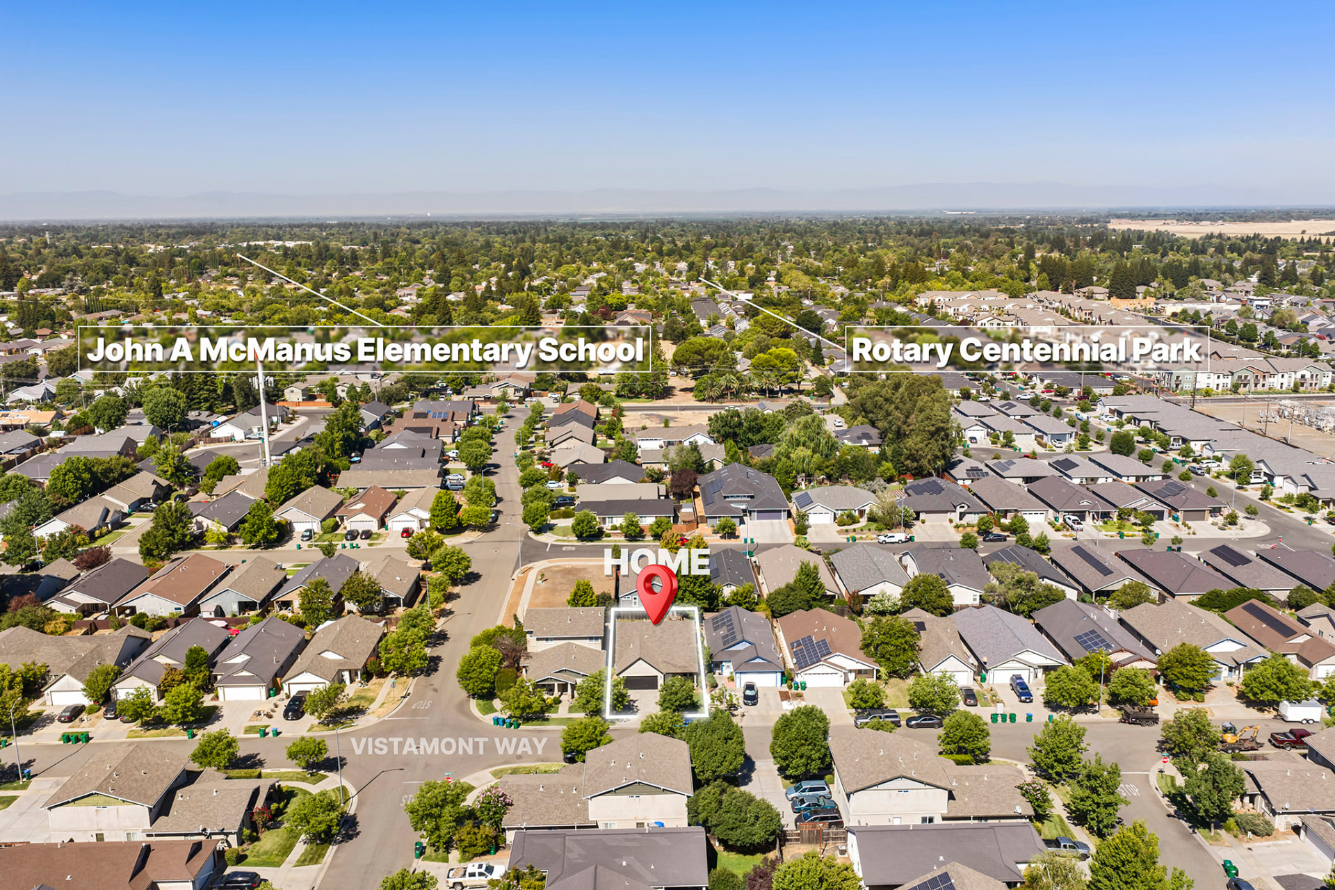 Aerial showing McManus Elementary and Rotary Park near the home