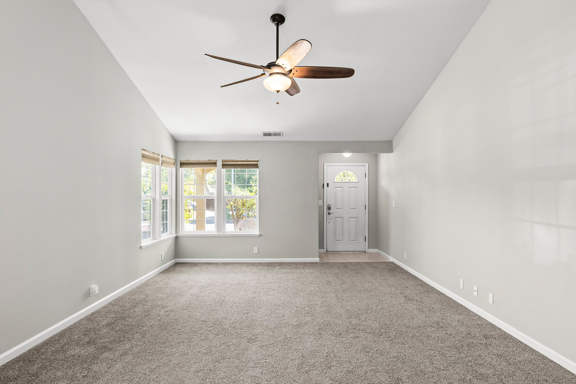 Living room looking toward the entry and bay windows