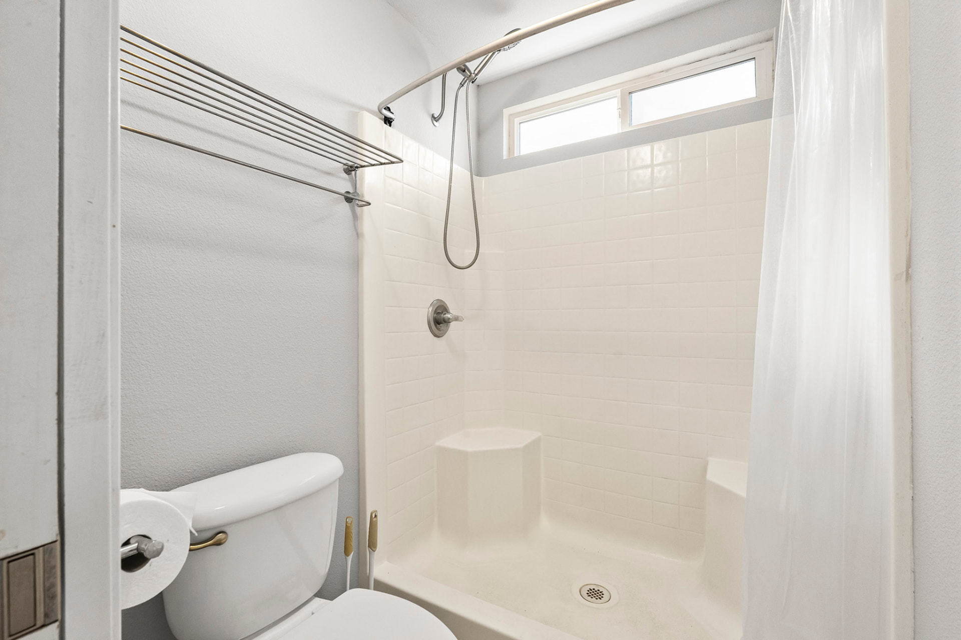 Primary bath with a walk-in shower and built-in seat