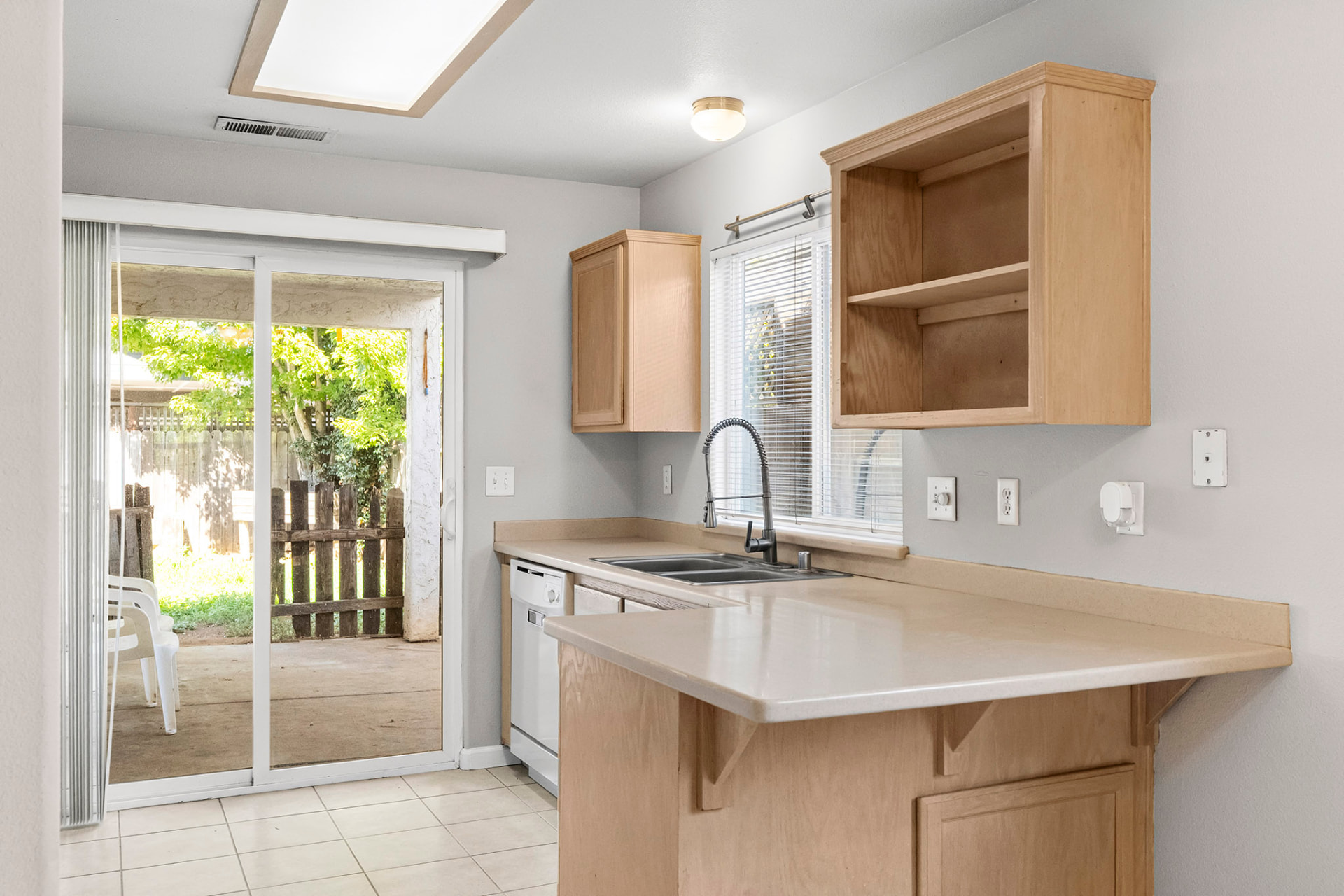 Kitchen breakfast bar with sink and window over the counter